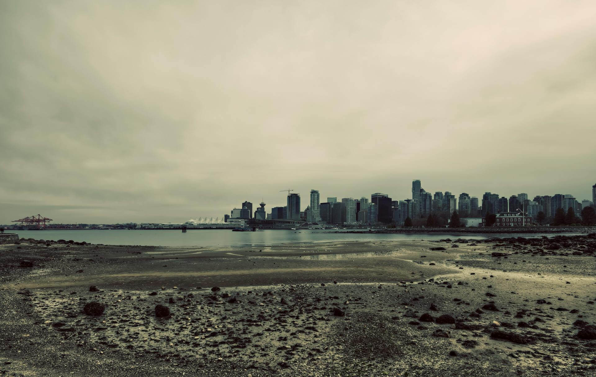 Rainy downtown Vancouver with skyline reflections seen from the Seawall