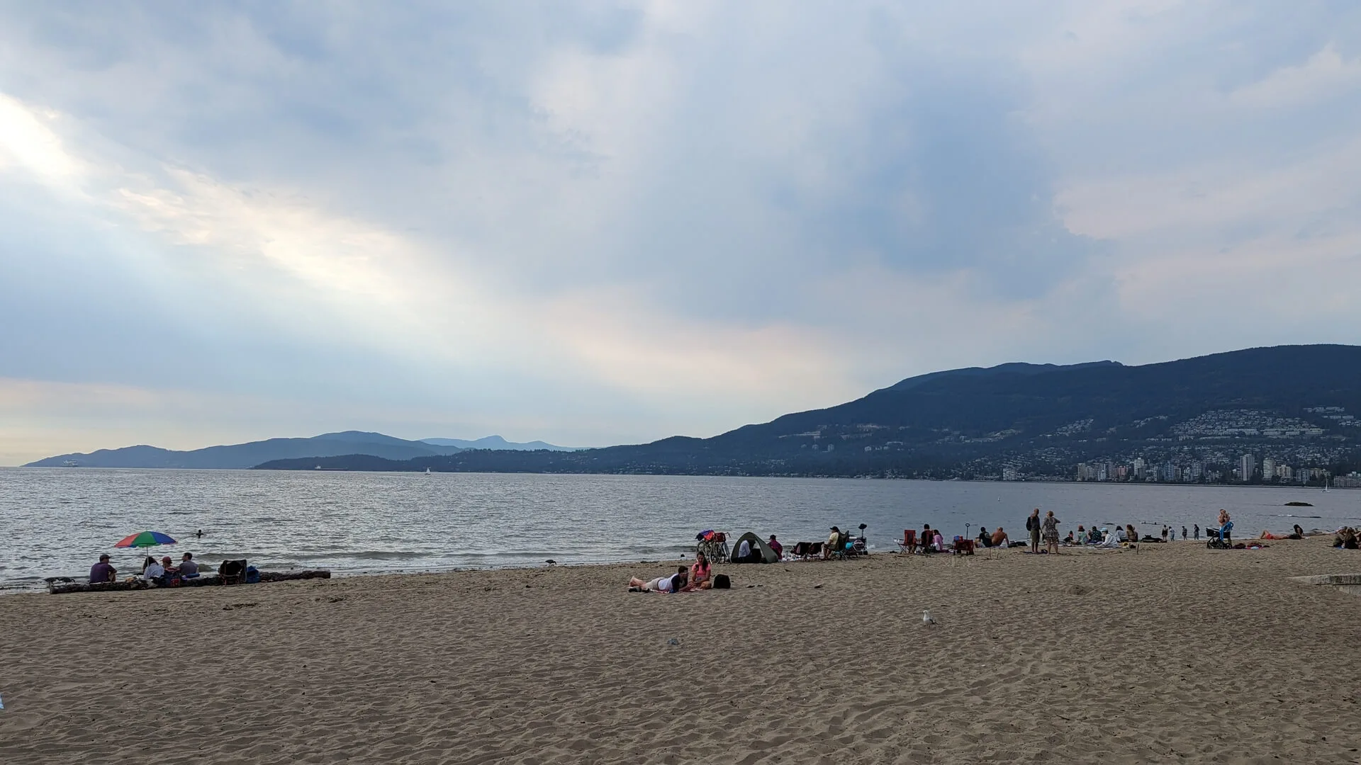 People relaxing at Third Beach in Stanley Park
