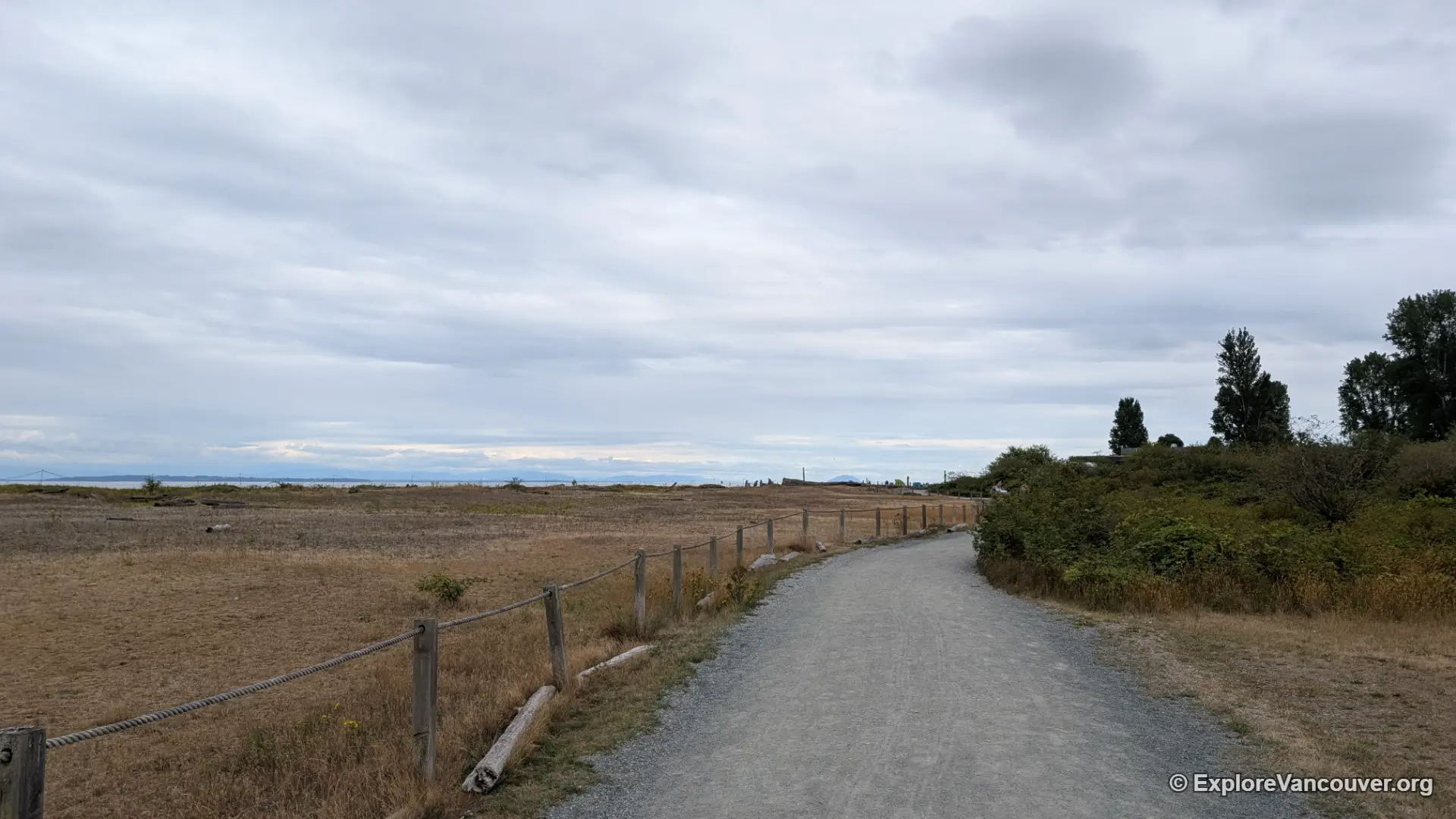 Walking trail through Boundary Bay Regional Park in Delta during fall