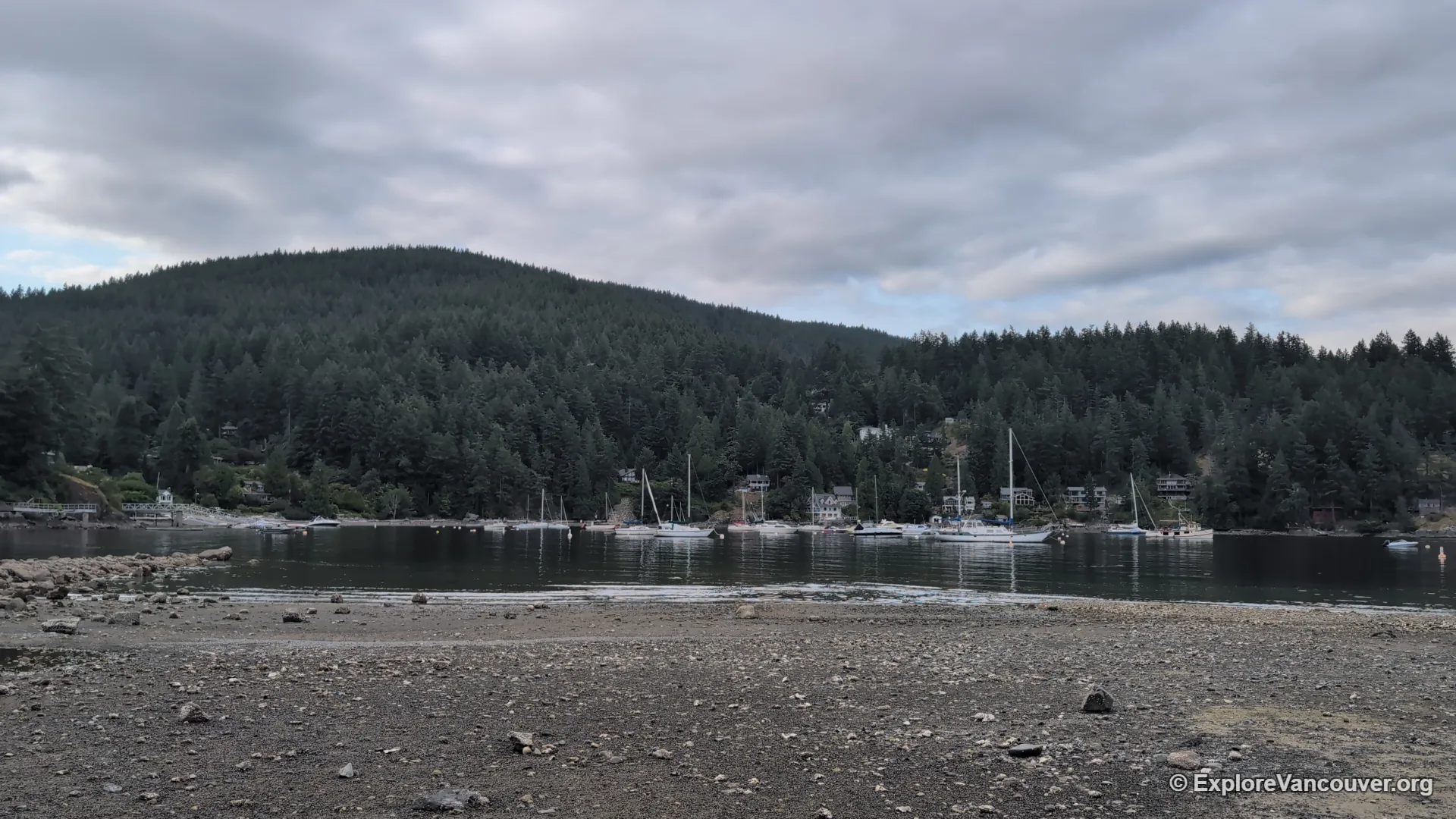 Sandy Beach on Bowen Island with forested shoreline