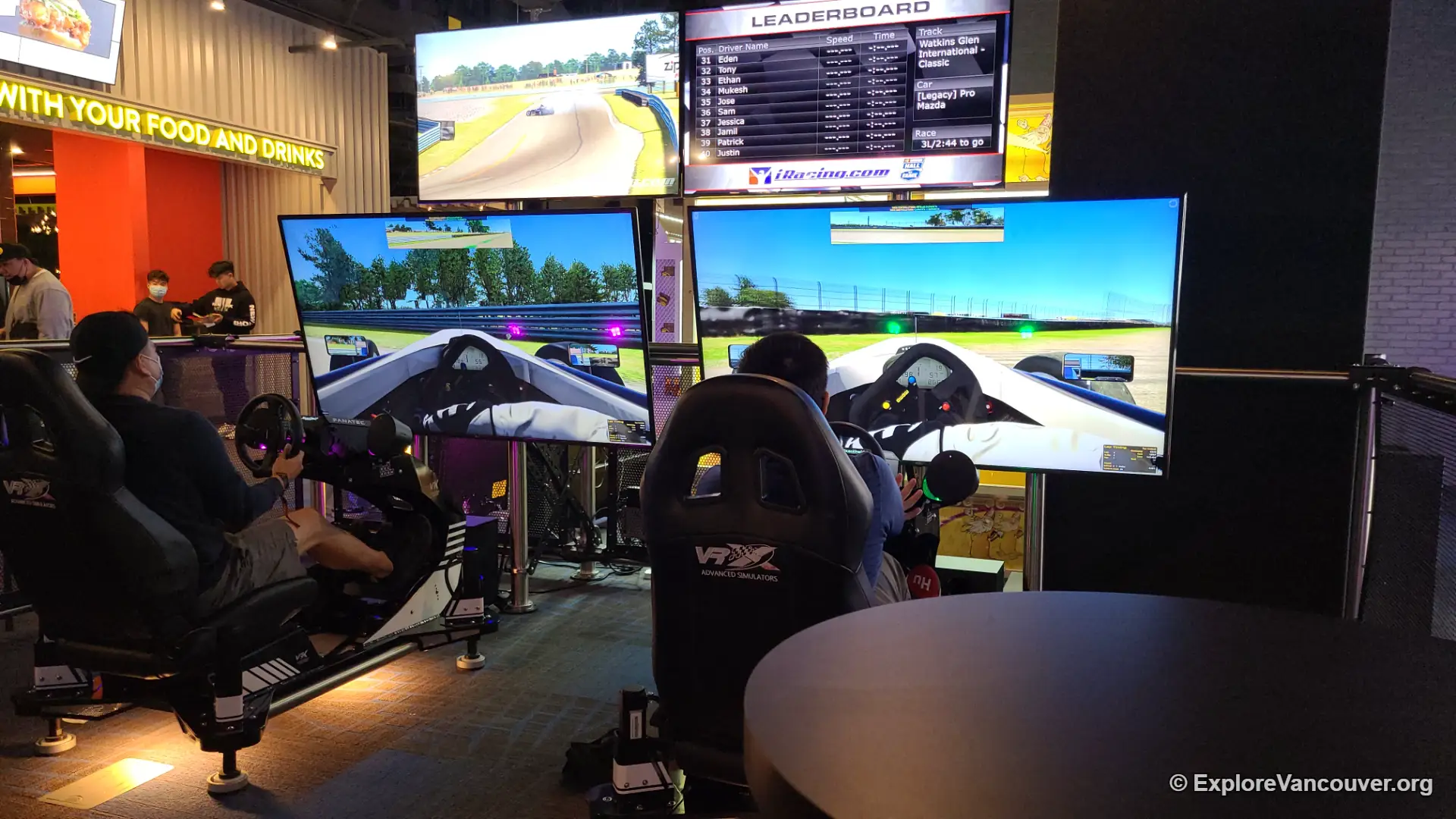 Racing arcade game with a big screen inside The Rec Room