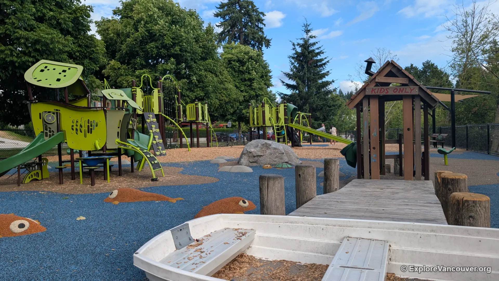 Fenced children's playground at Como Lake Park Coquitlam