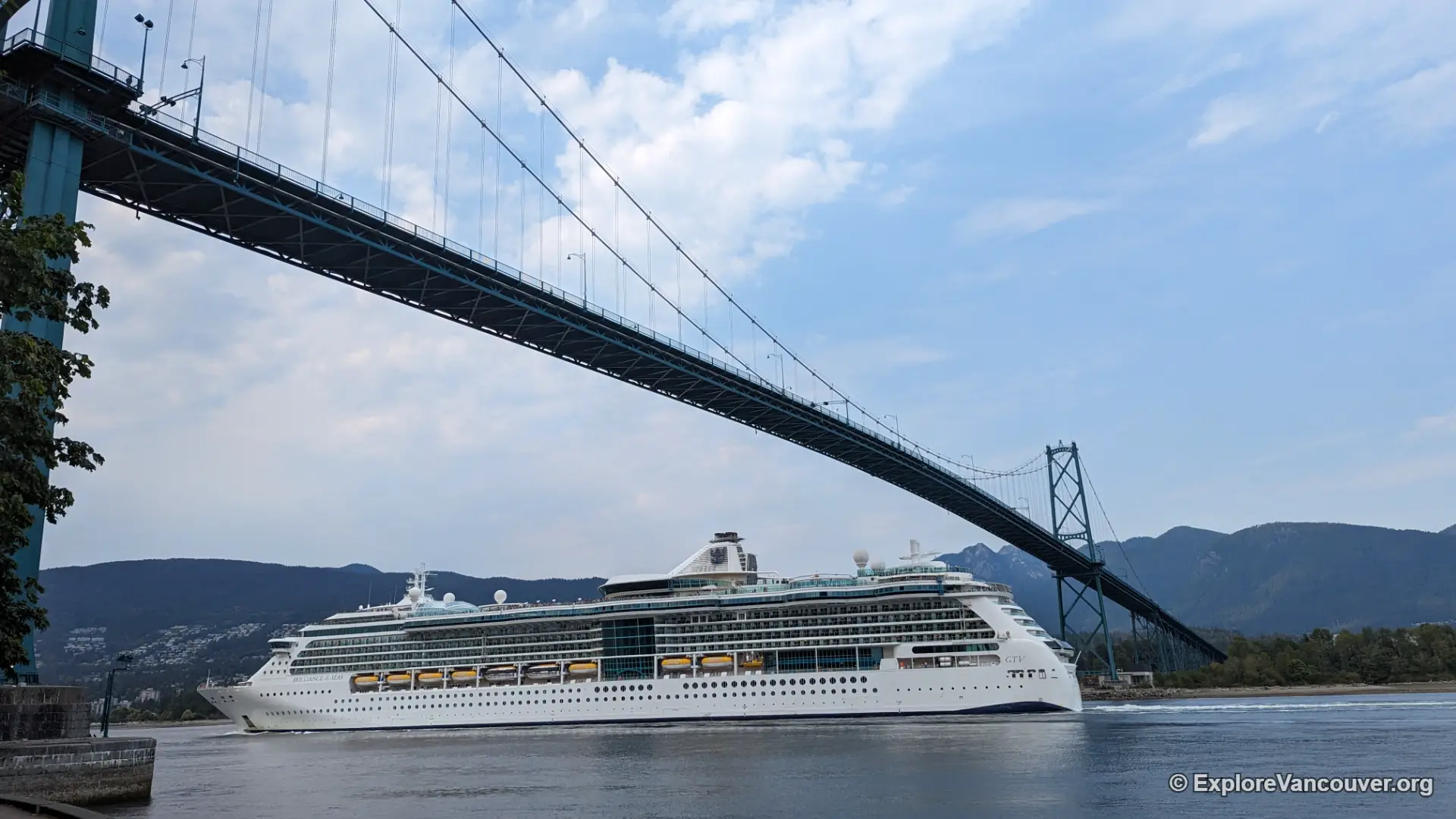 A cruise ship passing beneath the Lions Gate Bridge