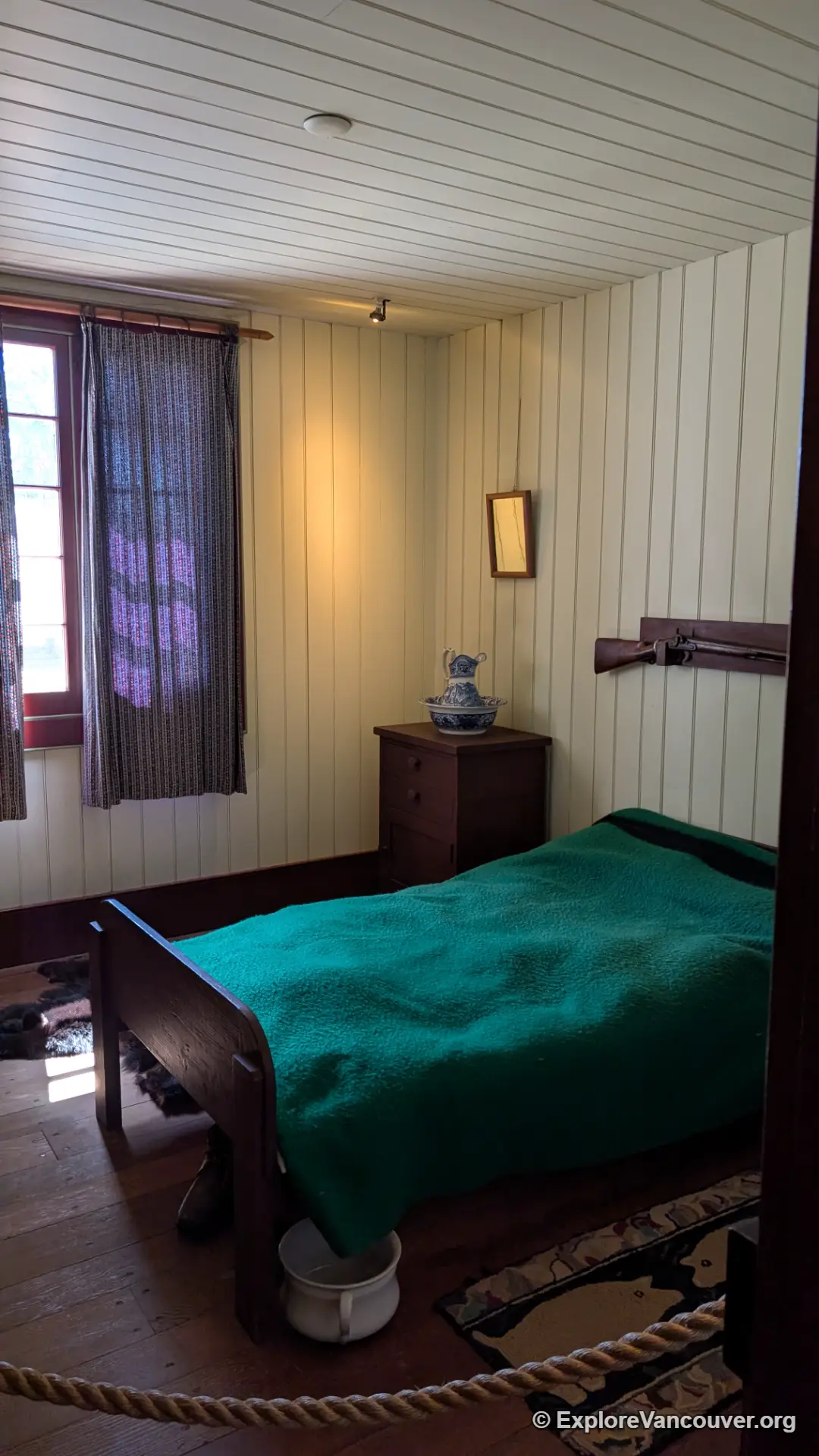 Period bedroom display inside the servants quarters at Fort Langley