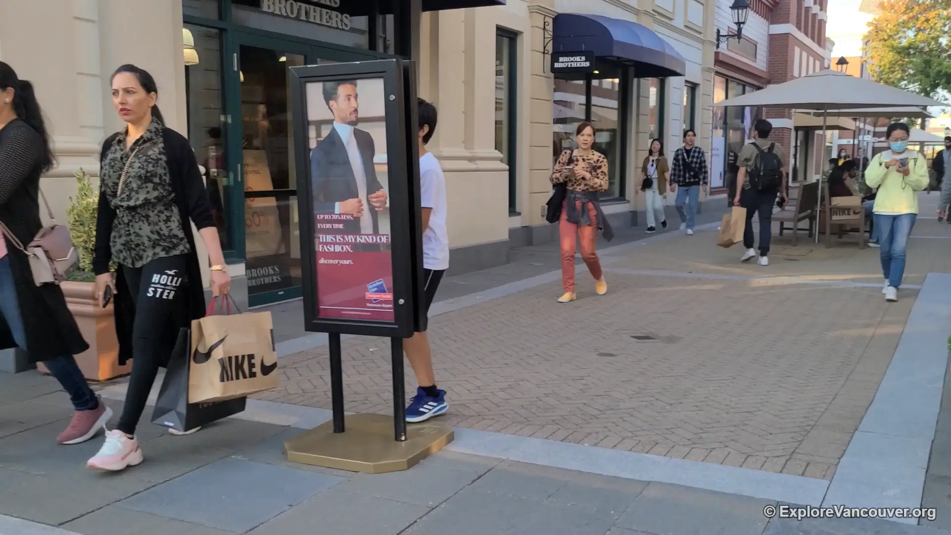 Pedestrian path lined with stores at McArthurGlen Designer Outlet