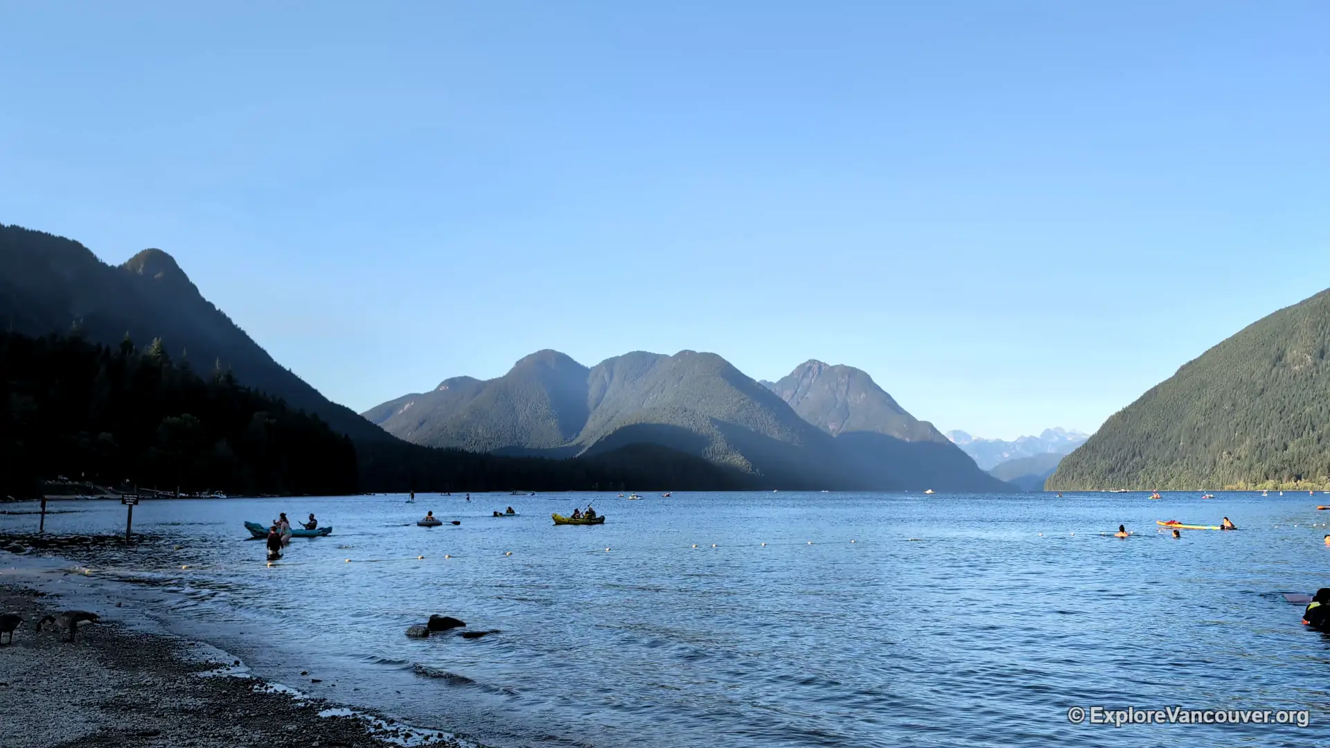 Sunset light over Alouette Lake with mountains in the background