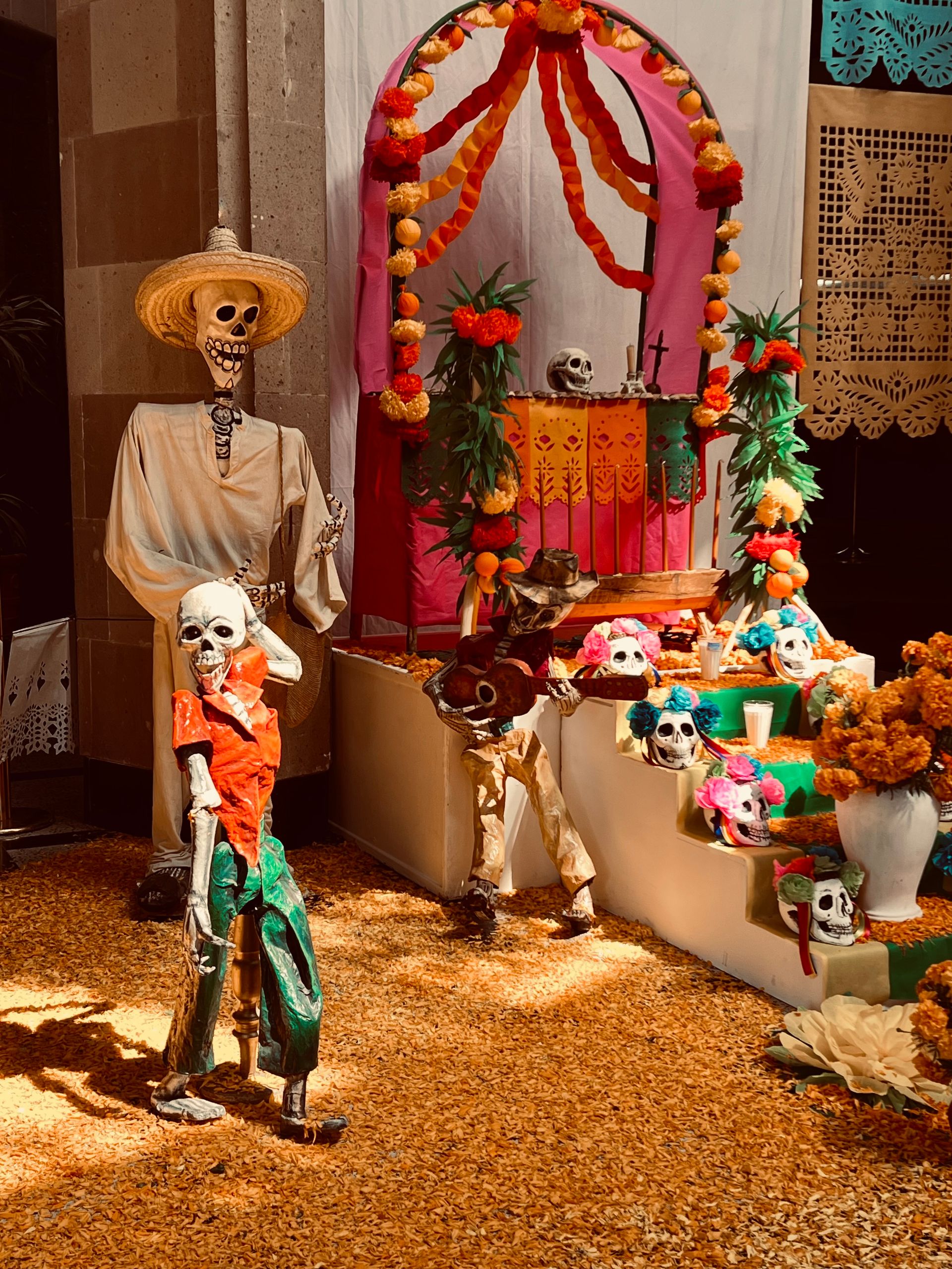 Traditional Day of the Dead altar with marigolds, candles and offerings