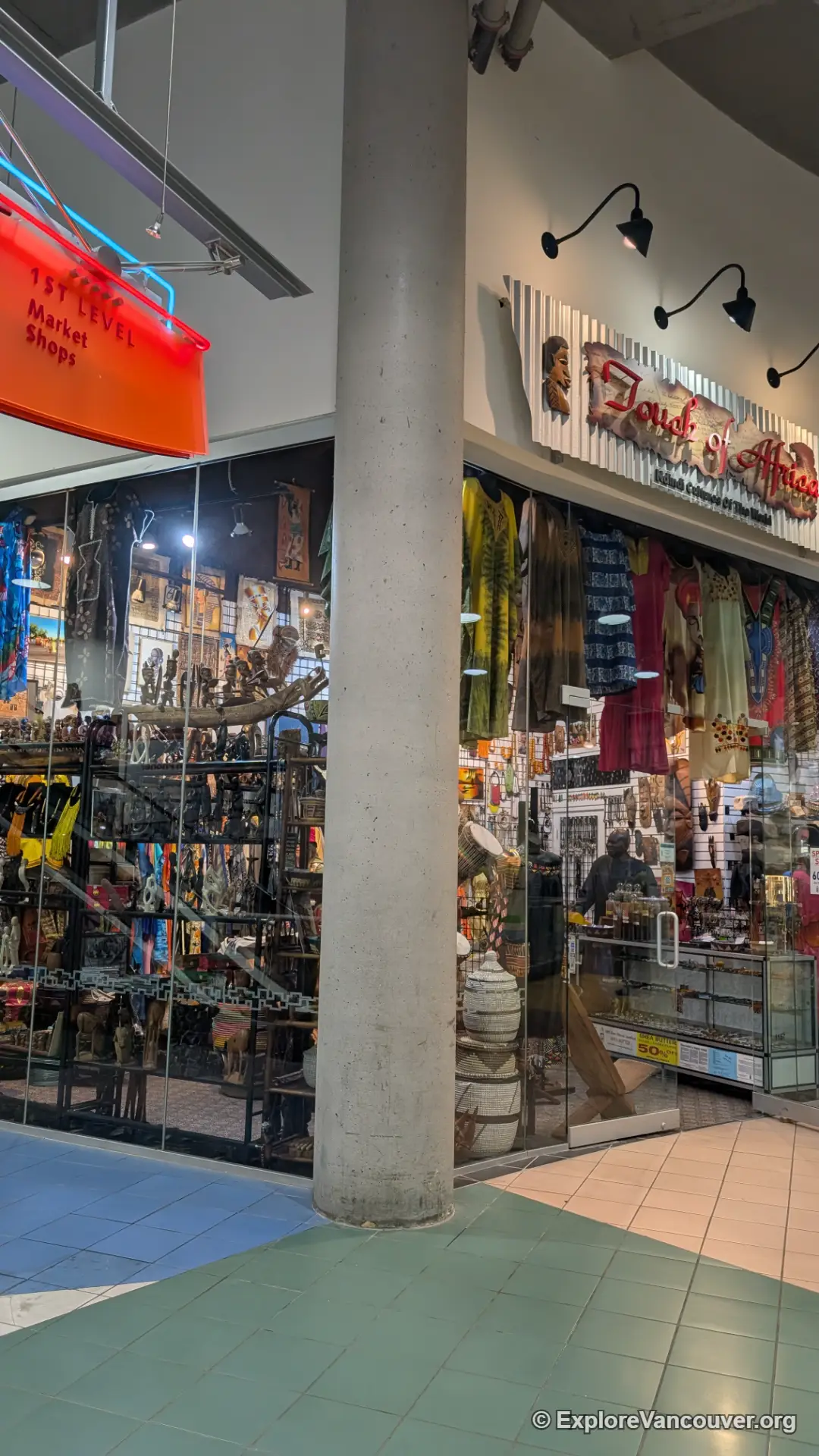 Row of shops inside International Village Mall, vertical view